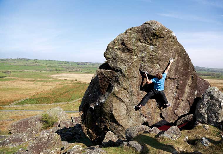 Adam Hocking on one of the hardest problems at Carrock Fell. Situated on the backside of Boardman’s Boulder it’s called Metronome and is graded at V11. Photo: © David Simmonite